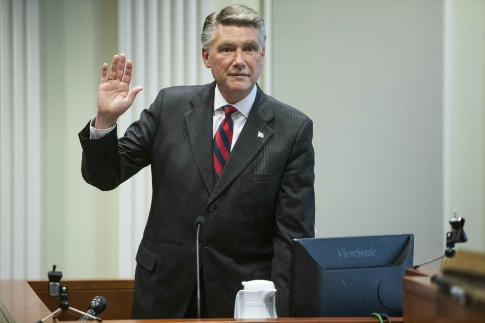 Mark Harris, Republican candidate in North Carolina's 9th Congressional race, prepares to testify during the fourth day of a public evidentiary hearing on the 9th Congressional District voting irregularities investigation Thursday, Feb. 21, 2019, at the North Carolina State Bar in Raleigh, N.C. (Travis Long/The News & Observer via AP, Pool)