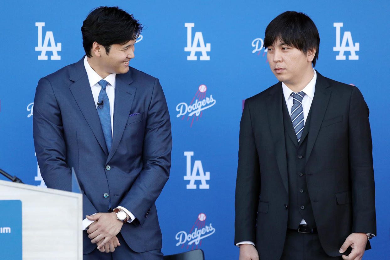 Shohei Ohtani with interpreter  Ippei Mizuhara at Dodgers introductory press conference. (Meg Oliphant / Getty Images)