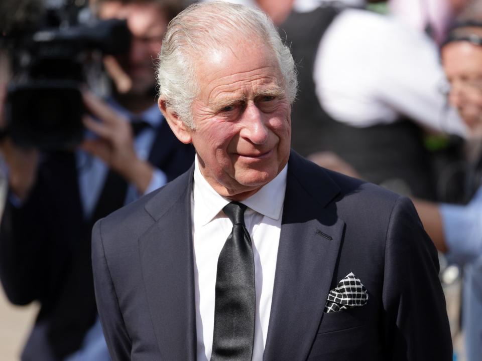 King Charles III in front of Buckingham Palace the day after Queen Elizabeth's death.