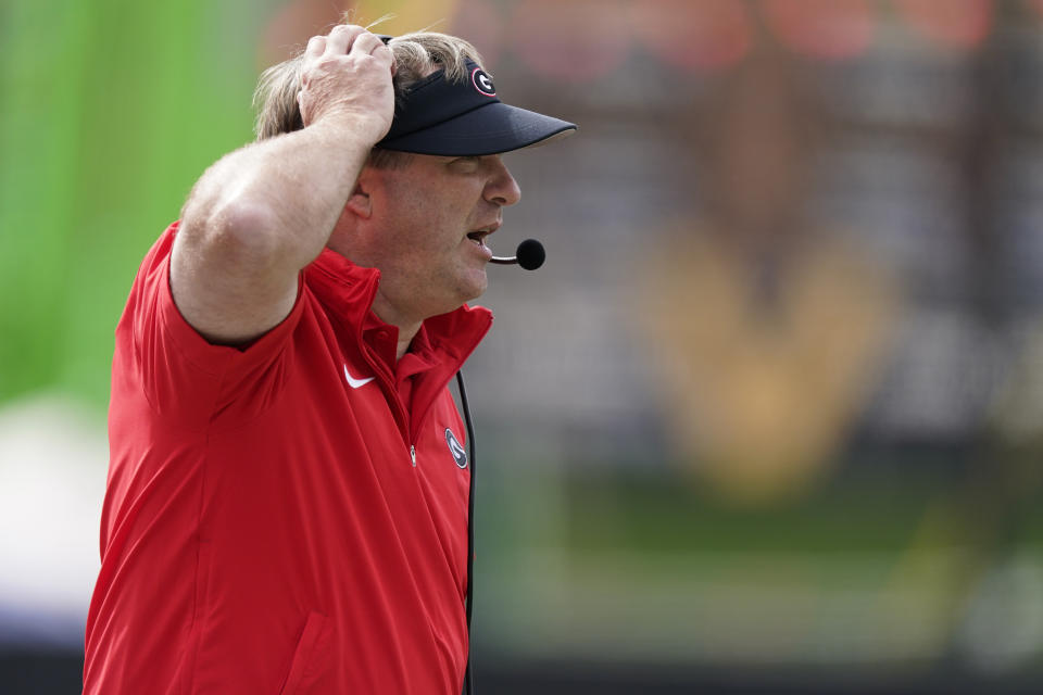 Georgia head coach Kirby Smart yells to his team from the sideline in the first half of an NCAA college football game against Vanderbilt, Saturday, Oct. 14, 2023, in Nashville, Tenn. (AP Photo/George Walker IV)