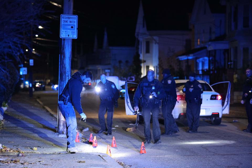 Police investigate a double shooting outside 76 Tremont St. in Brockton on Tuesday, Nov. 9, 2021.