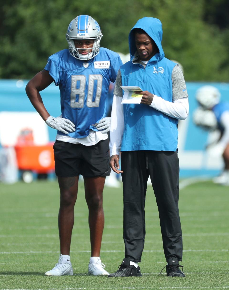 Wide receivers Antoine Green (80) and Jameson Williams talk on the field during joint practice with the Jacksonville Jaguars in Allen Park, Thursday, Aug. 17, 2023.