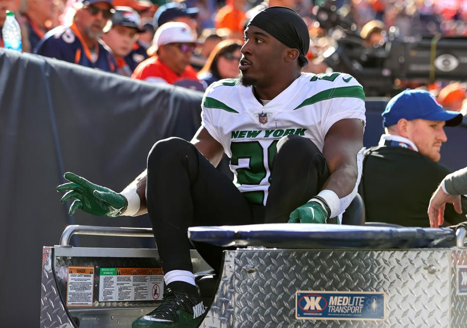 DENVER, CO - OCTOBER 23: New York Jets running back Breece Hall gets carted off the field after getting injured during a NFL game between the New York Jets and the Denver Broncos on October 23, 2022 at Empower Field at Mile High in Denver, CO. (Photo by Steve Nurenberg/Icon Sportswire via Getty Images)