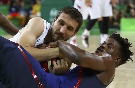 2016 Rio Olympics - Basketball - Final - Men's Gold Medal Game Serbia v USA - Carioca Arena 1 - Rio de Janeiro, Brazil - 21/8/2016. Jimmy Butler (USA) of the USA and Stefan Bircevic (SRB) of Serbia wrestle for the ball . REUTERS/Jim Young Picture Supplied by Action Images