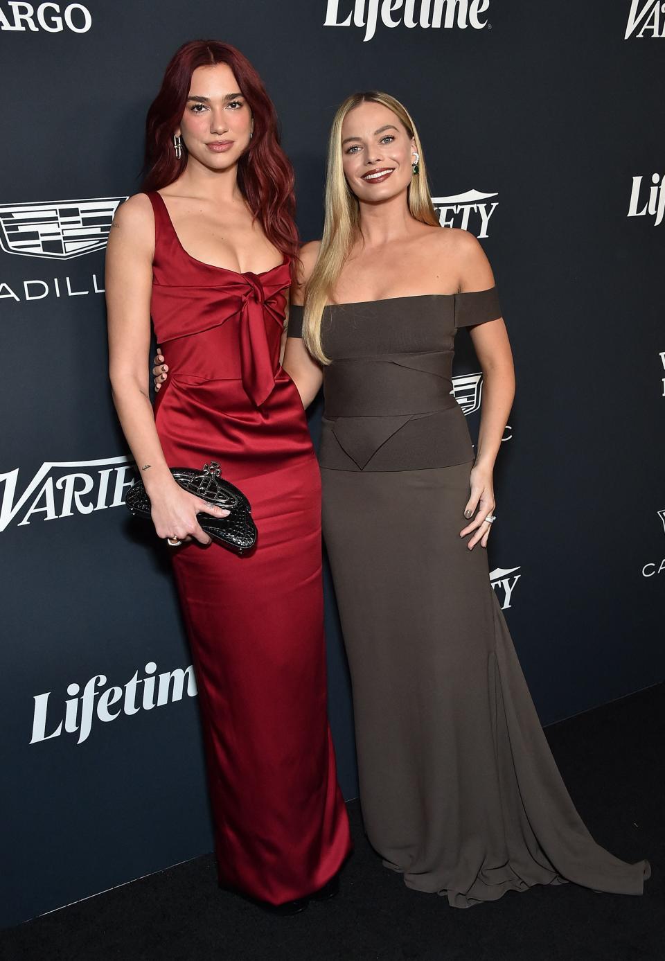 Mermaid Barbie Dua Lipa and the one and only Barbie Margot Robbie reunite at Variety's Power of Women in Los Angeles.