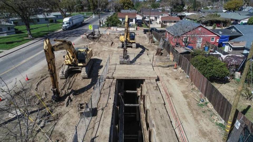 A construction worker fell nearly 30 feet behind a metal plate used to stabilize this trench on Sutter Avenue in west Modesto.