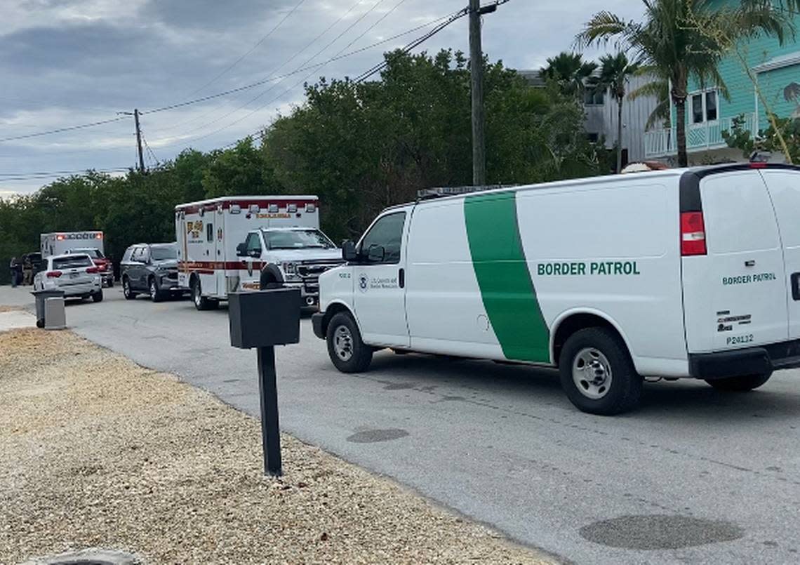 A U.S. Border Patrol van drives off carrying a group of Cuban migrants who arrived in a Florida Keys neighborhood in the Tavernier area Friday, Oct. 14, 2022.