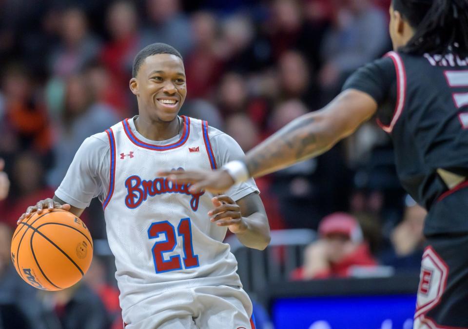 Bradley's Duke Deen is all smiles for his SIU-Edwardsville defender in the second half of their nonconference basketball game Thursday, Dec. 21, 2023 at Carver Arena. The Braves defeated the Cougars 75-64.