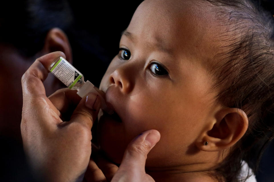 A child receives free polio vaccine during a government-led mass vaccination program in Quezon City, Metro Manila, Philippines, October 14, 2019. REUTERS/Eloisa Lopez