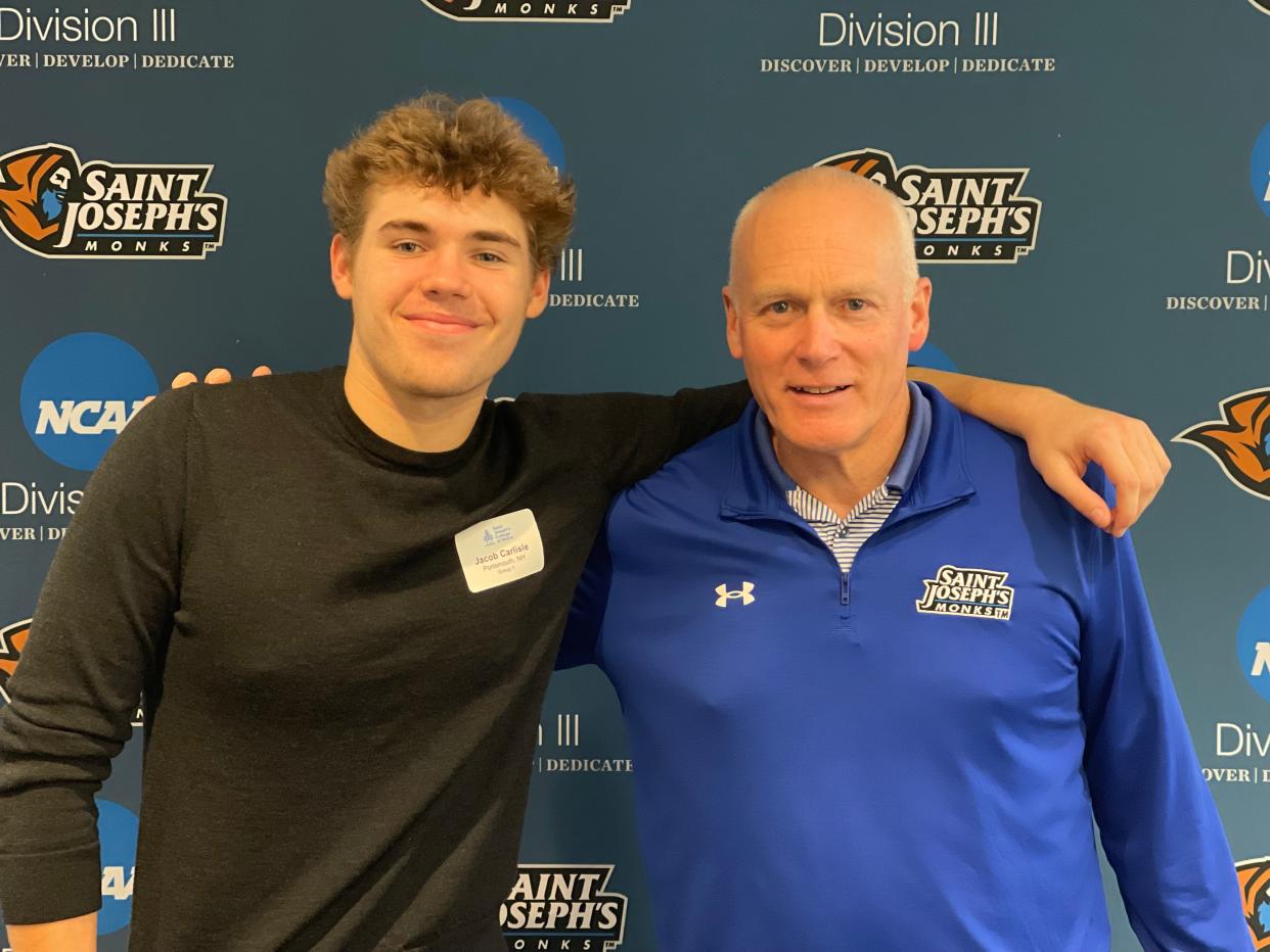 Portsmouth High School senior Jacob Carlisle stands with Saint Joseph's College head baseball coach Will Sanborn. Carlisle announced he will playing for the Monks, a Division III program in Standish, Maine next year.