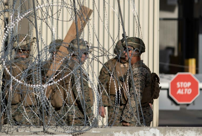 Military personnel have installed cement barriers and barbed-wire fencing at two border crossings from Tijuana into California