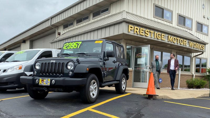 Alex Tovstanovsky, owner of used-car dealer Prestige Motor Works, checks on depleted inventory with his general manager Ryan Caton after sales jumped in May following two down months because of the coronavirus disease (COVID-19) pandemic in Naperville, Illinois, U.S. May 28, 2020. 