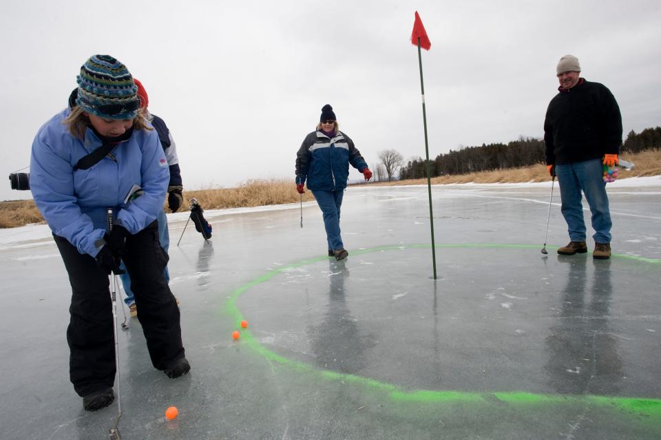Ice golfers play a round on frozen Lake Champlain in North Hero during the Great Ice event in 2010.