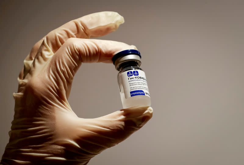 FILE PHOTO: FILE PHOTO: A medical specialist holds a vial of Sputnik V vaccine against the coronavirus in a department store in Moscow, Russia