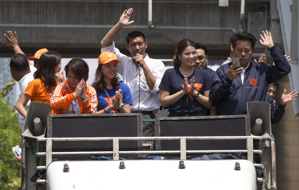 Thailand's Future Forward Party leader Thanathorn Juangroongruangkit, center, vehicle to thank people for their support in Bangkok, Thailand, Wednesday, April 3, 2019. Thailand's ruling junta has filed a complaint accusing Thanathorn of sedition and aiding criminals. The Future Forward Party ran a strong third in the elections last month that were also contested by a pro-military party. (AP Photo/Sakchai Lalit)