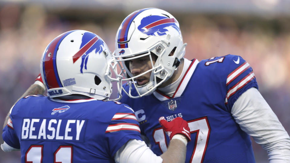 Buffalo Bills wide receiver Cole Beasley (11), left, is congratulated by quarterback Josh Allen after his touchdown catch during the second half of an NFL wild-card playoff football game against the Miami Dolphins, Sunday, Jan. 15, 2023, in Orchard Park, N.Y. (AP Photo/Joshua Bessex)