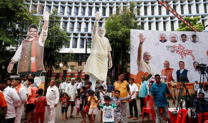 Cutouts and posters of BJP (Bharatiya Janata Party) leaders are seen outside the party office after learning of initial poll results in Mumbai