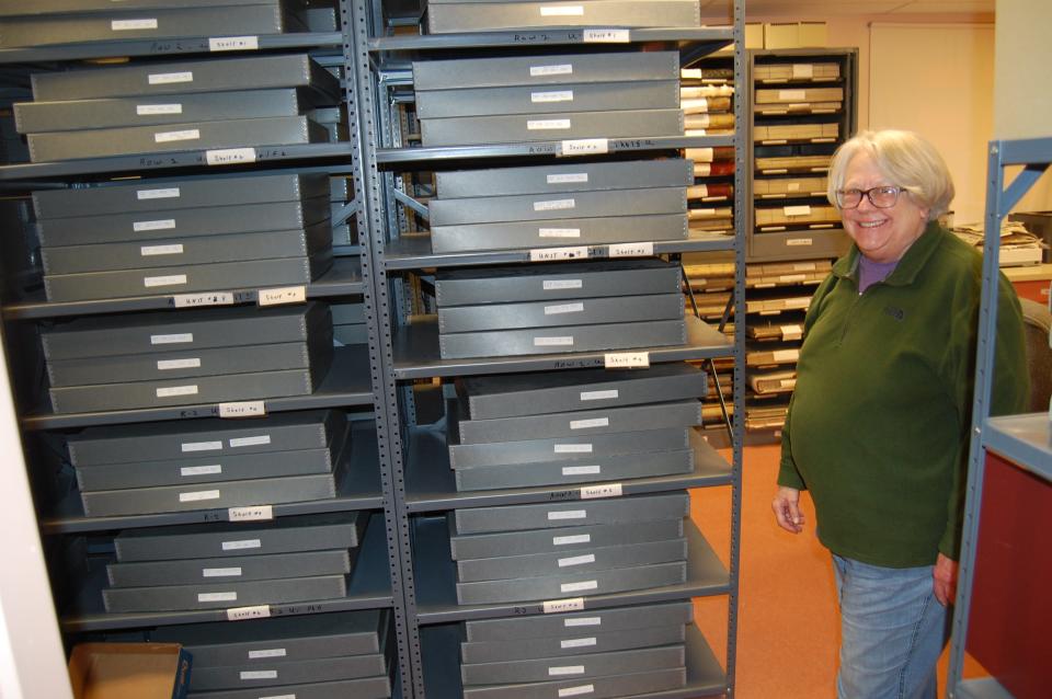 Patty Tharp, the former president of the San Juan County Historical Society, shows off the organization's cramped quarters in Aztec, which are stuffed floor to ceiling with historic documents, publications and government records.