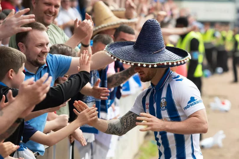 Matty Kennedy celebrates with Kilmarnock fans at full-time -Credit:Sammy Turner/SNS Group