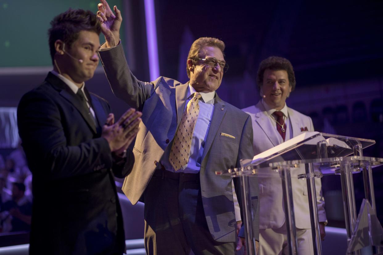 Jesse Gemstone (John Goodman), center, addresses his megachurch congregation as he's flanked by his sons, Kelvin (Adam Devine), left, and Jesse (Danny McBride), in HBO's 'The Righteous Gemstones.'