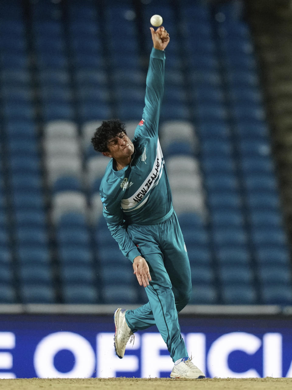 New Zealand's Rachin Ravindra bowls against Uganda during an ICC Men's T20 World Cup cricket match at the Brian Lara Cricket Academy in Tarouba, Trinidad and Tobago, Friday, June 14, 2024. (AP Photo/Ramon Espinosa)