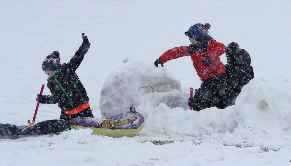 A boy fires one of his arsenal of snowballs from the safety of a snow fort Jan. 7 at South Orangetown Middle School in Blauvelt.