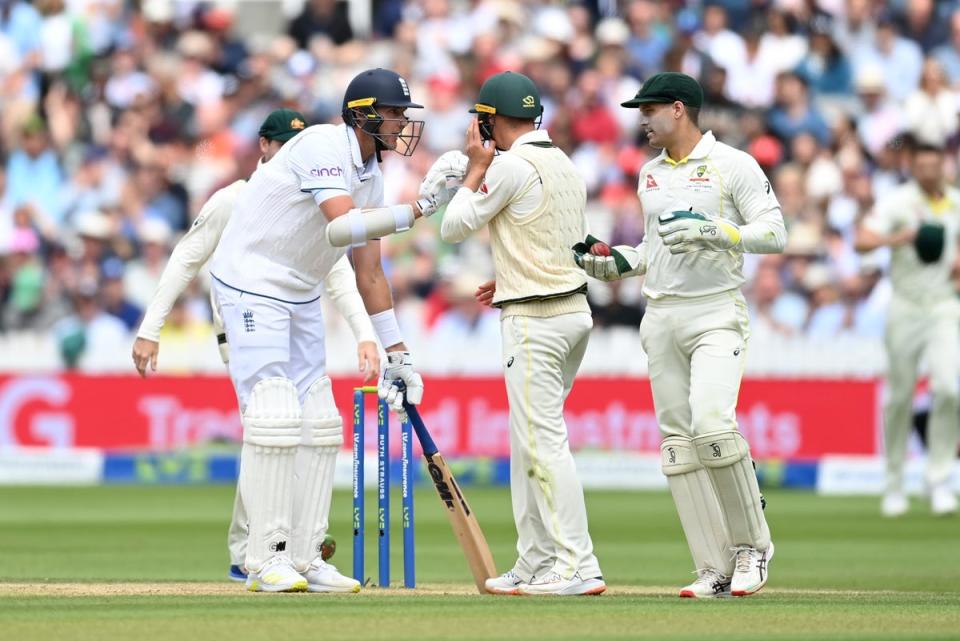 Broad checks with wicketkeeper Carey whether he is allowed to leave his crease (Getty)