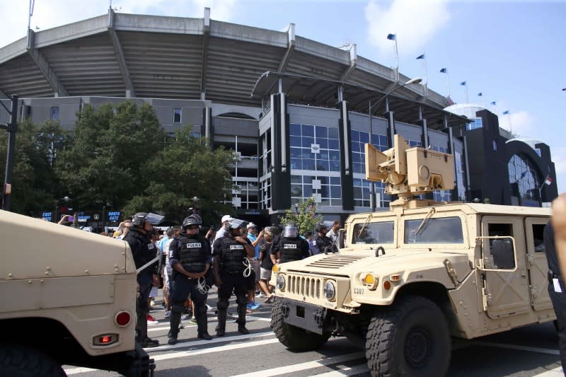 <p>The National Guard arrives as people gather outside the football stadium as the NFL’s Carolina Panthers host the Minnesota Vikings, to protest the police shooting of Keith Scott, in Charlotte, North Carolina, U.S., September 25, 2016. REUTERS/Mike Blake </p>