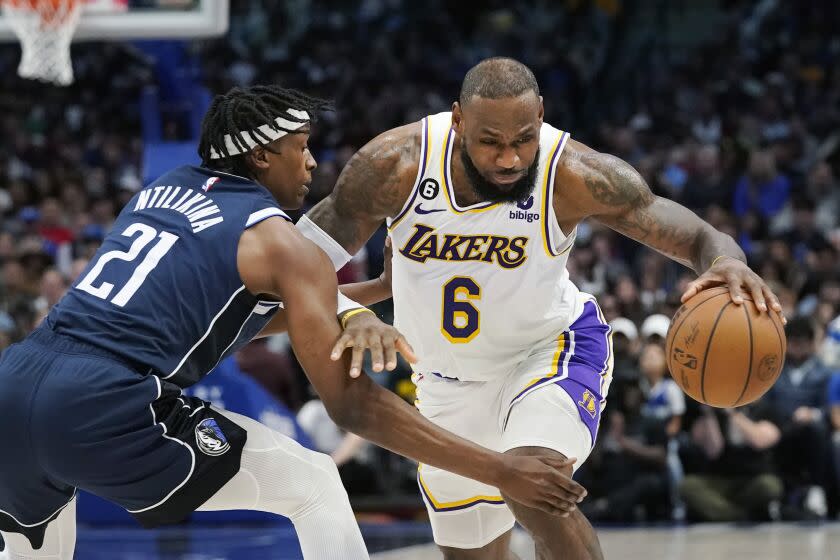Los Angeles Lakers forward LeBron James (6) drives against Dallas Mavericks guard Frank Ntilikina.