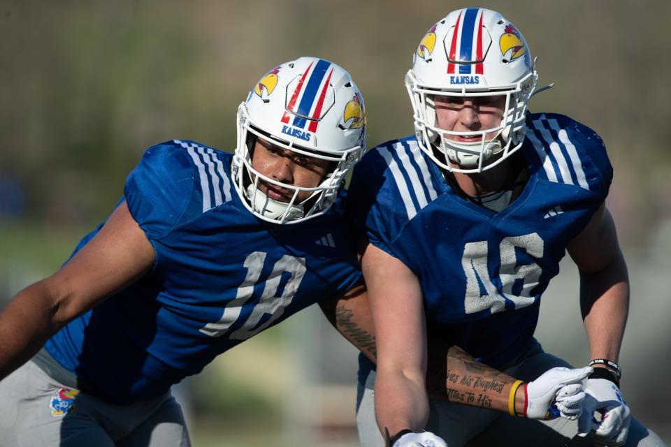 Kansas football redshirt senior tight end DeShawn Hanika (18) works with redshirt freshman tight end Dillon Mong (46) during a practice April 4, 2024 in Lawrence.