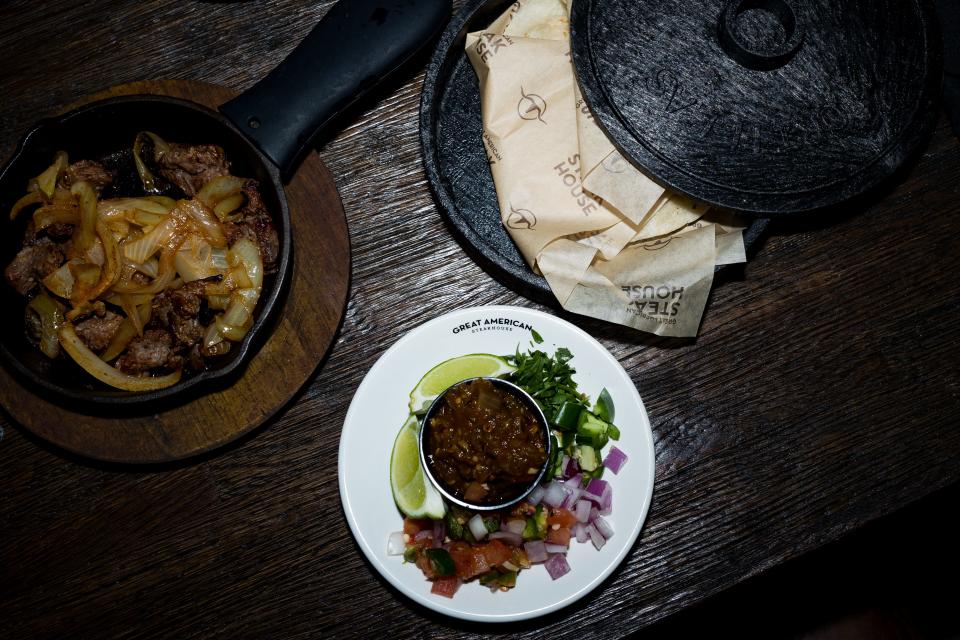 Sirloin steak with grilled onions and tortillas on the side with salsa, lemon, cilantro, onion and pico de gallo is prepared at the newly remodeled Great American Steakhouse in Northeast El Paso on Tuesday, Jan. 9, 2024. The restaurant recently reopened right before the new year.