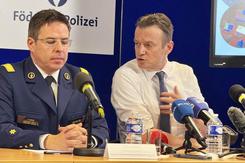 Belgium's Federal Police Commissioner General Eric Snoek, left, and Belgian Justice Minister Paul Van Tigchelt address a media conference in Brussels, Thursday, Feb. 15, 2024. The grim picture of violent crime related to drugs is becoming increasingly visible in Europe's capital city. Drug dealers have recently fought in the heart Brussels for several days, leaving in their wake one dead and others injured. (AP Photo/Sylvain Plazy)