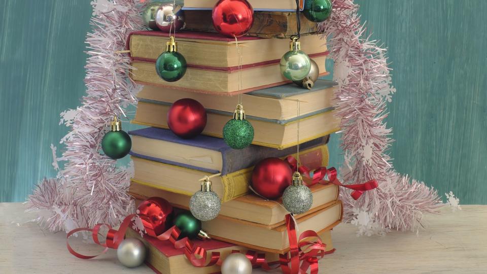 books as christmas gift,christmas present,reading,literature,education, christmas,holiday concept with christmas tree and decoration