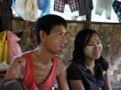 AIDS patient Myo Min Tun, left, 38, talks during an interview along with his AIDS patient wife Zin Mar Shwe, right, 32, at HIV/AIDS care center founded by Phyu Phyu Thin, a parliament member of Myanmar Opposition Leader Aung San Suu Kyi's National League for Democracy Party, in outskirts of Yangon, Myanmar, Saturday, Mar. 1, 2014. Doctors Without Borders said Friday it has been expelled from Myanmar and that tens of thousands of lives are at risk.The government defended the move Friday, accusing the organization of creating tensions and instability in violence-scarred Rakhine state, where it has faced repeated protests for treating members of the long-persecuted Rohingya Muslim minority. (AP Photo/Khin Maung Win)