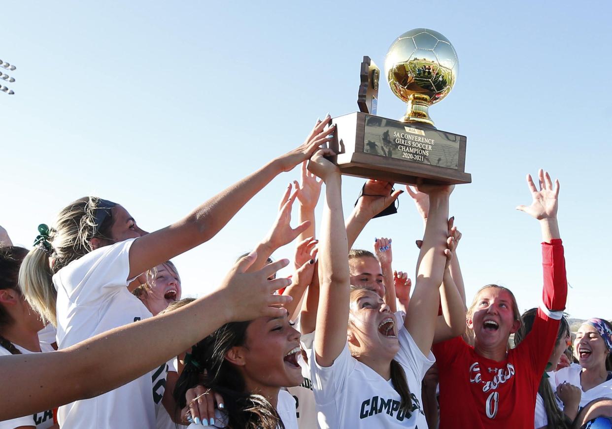 Campo Verde High School celebrates after defeating Casteel High School during the Girls 5A soccer final at Desert Vista High School in Phoenix on March 20, 2021.