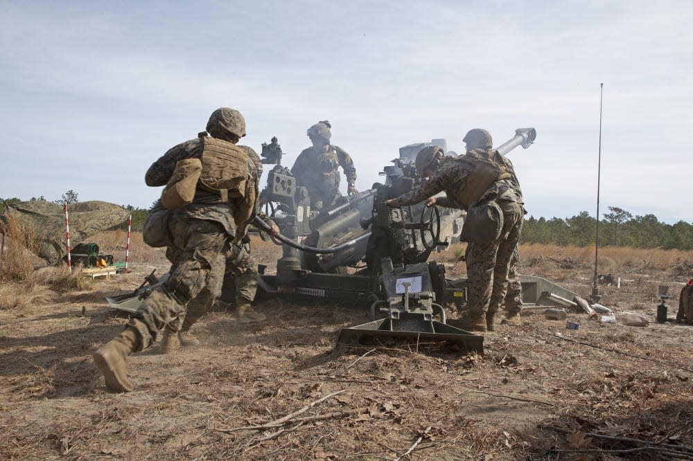 Marines with Alpha Battery, 1st Battalion, 10th Marine Regiment, 2nd Marine Division, fire a 155mm Howitzer during the regiment's Rolling Thunder exercise March 12, 2019, at Fort Bragg. The Marines are back in the area for the biannual training exercise through the end of April 2021.