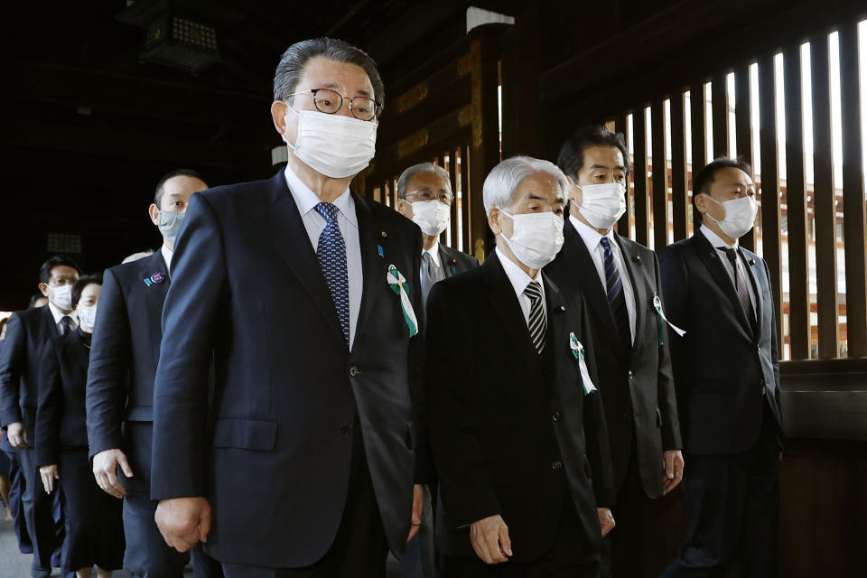 Japanese lawmakers visit the Yasukuni Shrine in Tokyo Tuesday, Dec. 7, 2021. A group of about 100 Japanese lawmakers prayed at the Tokyo shrine viewed by China and the Koreas as a symbol of Japanese wartime aggression on Tuesday, the eve of Japan’s Pearl Harbor attack 80 years ago. (Kenzaburo Fukuhara/Kyodo News via AP)