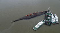 An aerial view shows rescue workers searching on the sunken ship at Jianli section of Yangtze River, Hubei province, China, June 2, 2015. REUTERS/Stringer