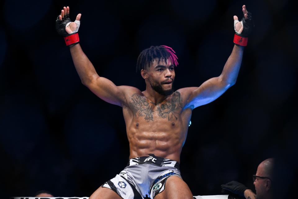 Sep 2, 2023; Paris, France; Morgan Charriere (red gloves) celebrates defeating Manolo Zecchini (blue gloves) during UFC Fight Night at Accor Arena. Mandatory Credit: Per Haljestam-USA TODAY Sports