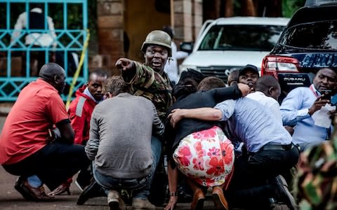 Kenyan special forces protect people at the scene - Credit: AFP