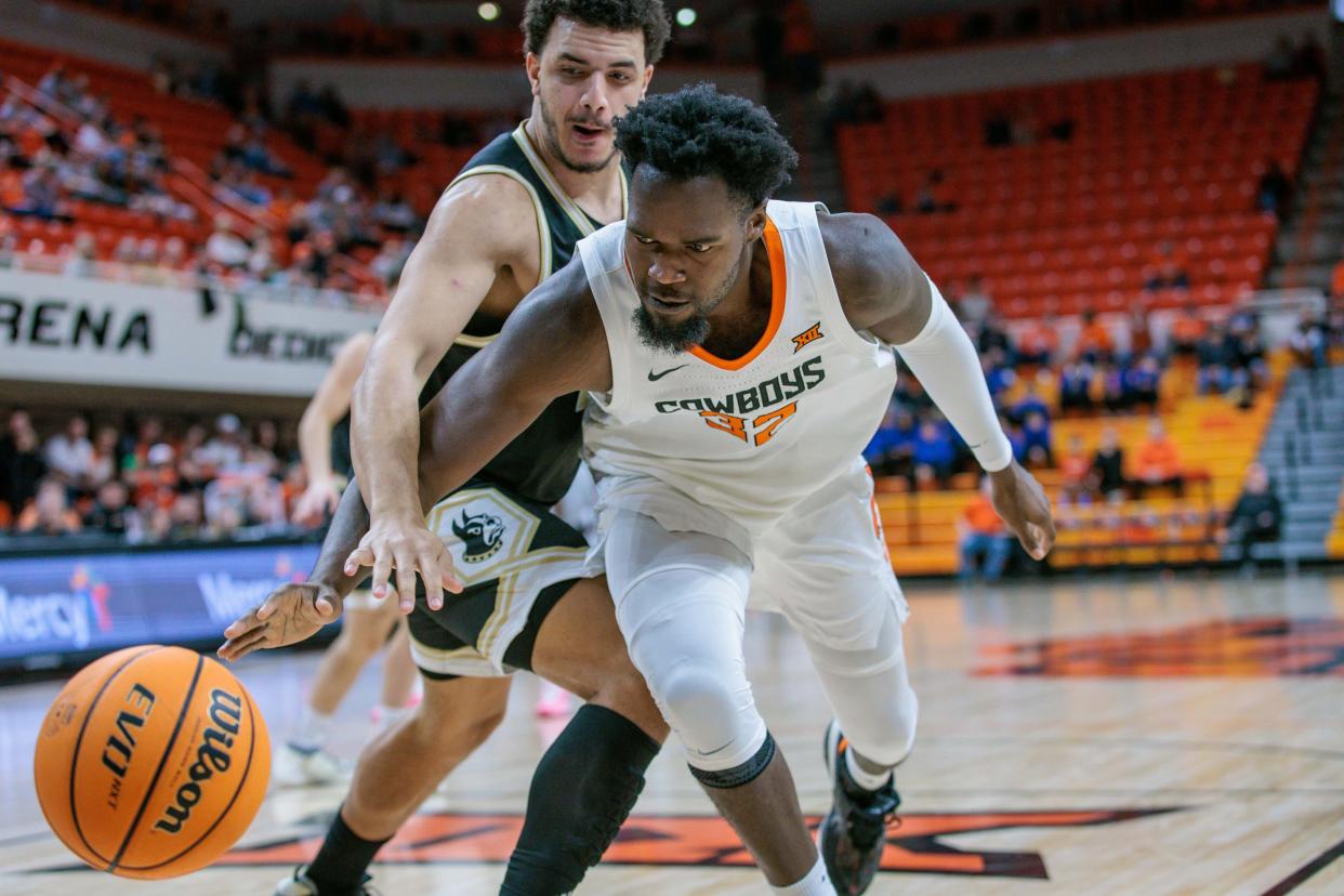 Dec 20, 2023; Stillwater, Oklahoma, USA; Oklahoma State Cowboys center Mike Marsh (32) goes after a loose ball during the first half against the Wofford Terriers at Gallagher-Iba Arena. Mandatory Credit: William Purnell-USA TODAY Sports