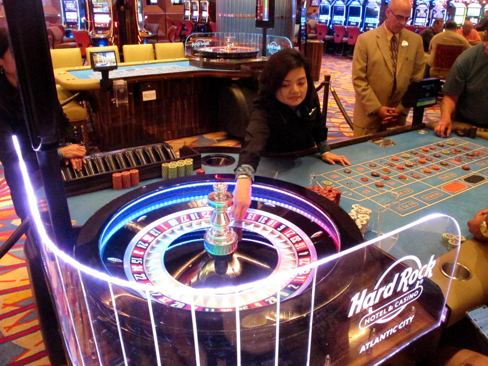 In this June 20, 2019 photo, a dealer throws the roulette ball during a game at the Hard Rock casino in Atlantic City, N.J. The Ocean and Hard Rock casinos both reopened on June 27, 2018, and are fighting for business in the expanded Atlantic City gambling market. (AP Photo/Wayne Parry)