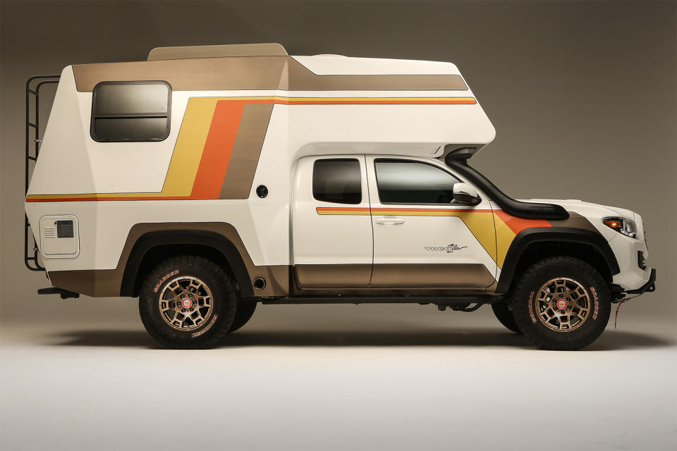 The side profile of the Toyota Tacozilla Tacoma Camper built for SEMA 2021. The retro overlander features a shower, kitchen and tons of sleeping space.