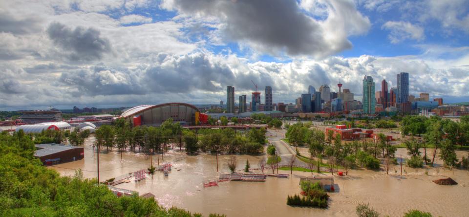 [UNVERIFIED CONTENT] A panoramic view of the flooded stampede grounds. Image was taken on June 21st at approximately 2pm. The Saddledome (Calgary flames) was full of water up to row 10 and the Calgary downtown core was also flooded.   Bow River normal water levels are approx. 250 cubic meters per second...during the flood the Bow River was at 1,458 cu meters per second.  The Elbow river running through Calgary on the south central part of the city was flooding simultaneously as the Bow River was flooding this caused a perfect storm, when both rivers breached, the inner city of Calgary was lost as well as any communities that were along both rivers...devastating and heart breaking for the residents residing in these areas.  Calgary and southern Alberta have been devastated by a flood in June 2013.  Calgary, Alberta