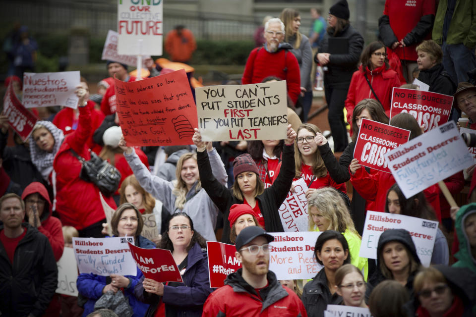 In this April 10, 2019 photo educators from across the metro are gathered at Pioneer Courthouse Square to press the Oregon Legislature for more school funding. Tens of thousands of teachers are expected to walk out across Oregon this week, adding to the string of nationwide protests over class sizes and education funding. Schools around the state, including Oregon's largest district, Portland Public Schools, will close for at least part of Wednesday, May 8, 2019 as educators press for more money from lawmakers. (Mark Graves/The Oregonian via AP)