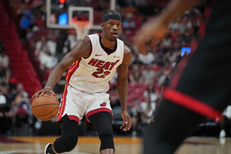 Apr 14, 2024; Miami, Florida, USA; Miami Heat forward Jimmy Butler (22) brings the ball up the court against the Toronto Raptors during the first half at Kaseya Center. Mandatory Credit: Jim Rassol-USA TODAY Sports