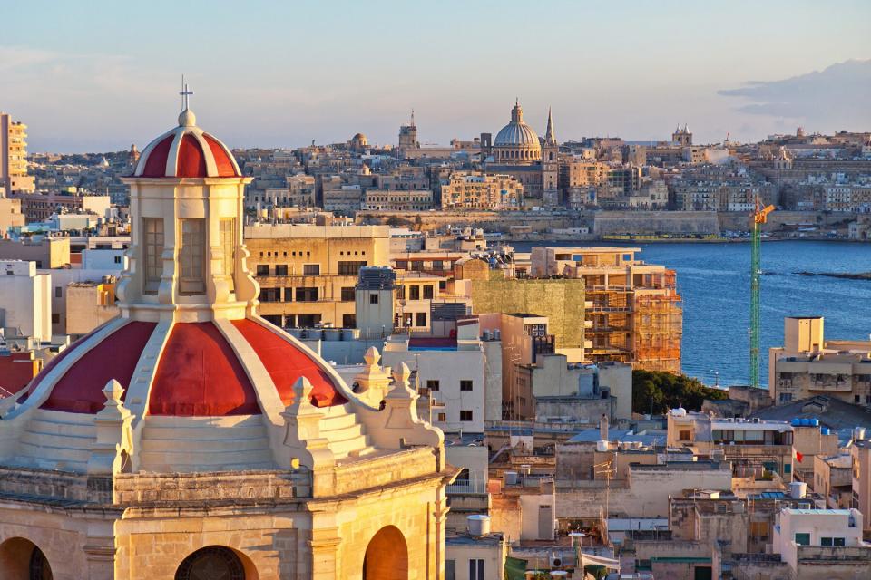 This is a view from The Palace in Sliema over Valletta with a church in the foreground