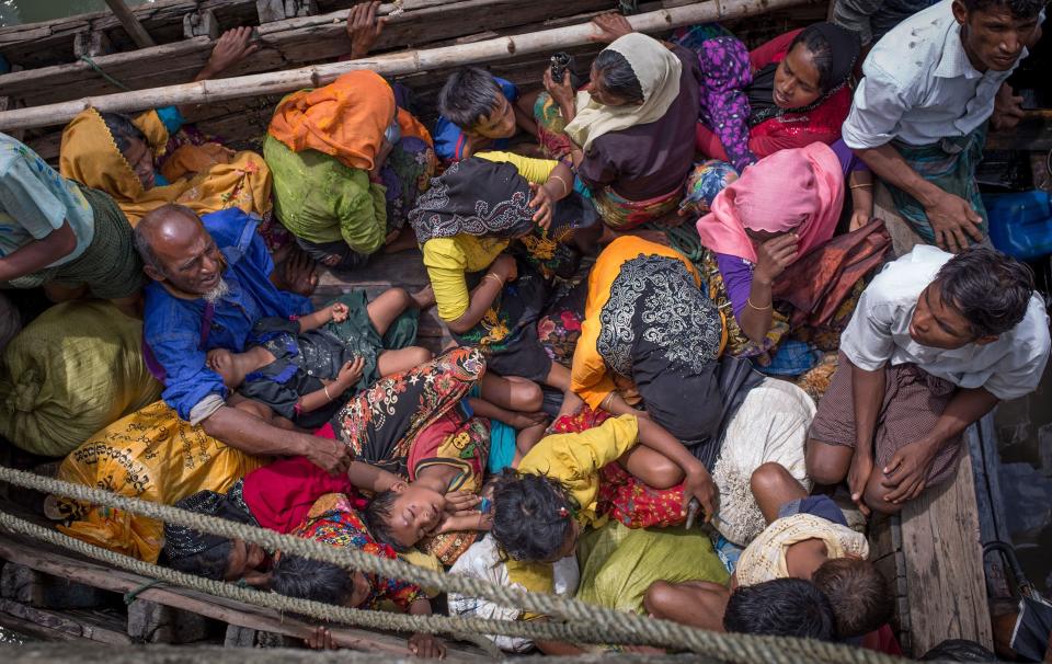 This photograph taken on Sept. 12, 2017, shows Rohingya refugees arriving by boat at Shah Parir Dwip on the Bangladesh side of the Naf River after fleeing violence in Myanmar.