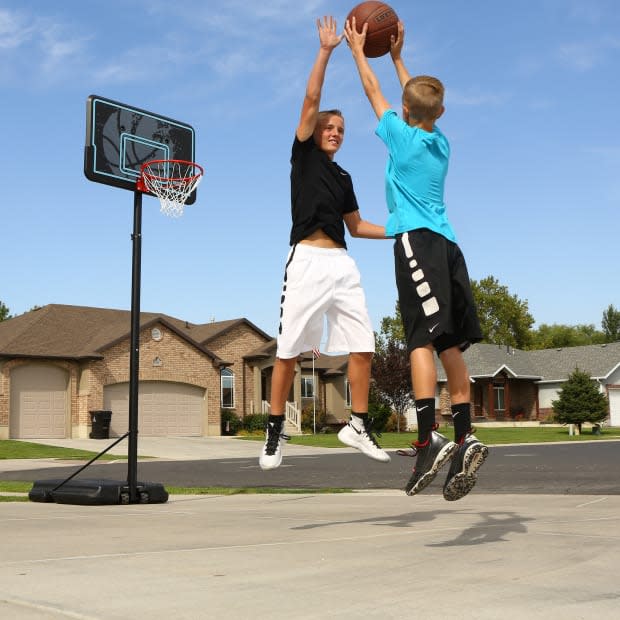 <p>This portable basketball hoop has a telescoping pole that can adjust the rim height from 7.5' to 10' in 6" increments. </p><p><strong><a href="https://go.skimresources.com?id=113896X1572730&xs=1&url=https%3A%2F%2Fwww.walmart.com%2Fip%2FLifetime-44-Impact-Adjustable-Portable-Basketball-Hoop-90759%2F54827137&sref=parade.com%2Fshopping%2Fbest-gifts-under-100" rel="noopener" target="_blank" data-ylk="slk:Lifetime 44" Impact Adjustable Portable Basketball Hoop, $131 at Walmart;elm:context_link;itc:0;sec:content-canvas" class="link ">Lifetime 44" Impact Adjustable Portable Basketball Hoop, $131 at Walmart</a></strong></p><p>Walmart</p>