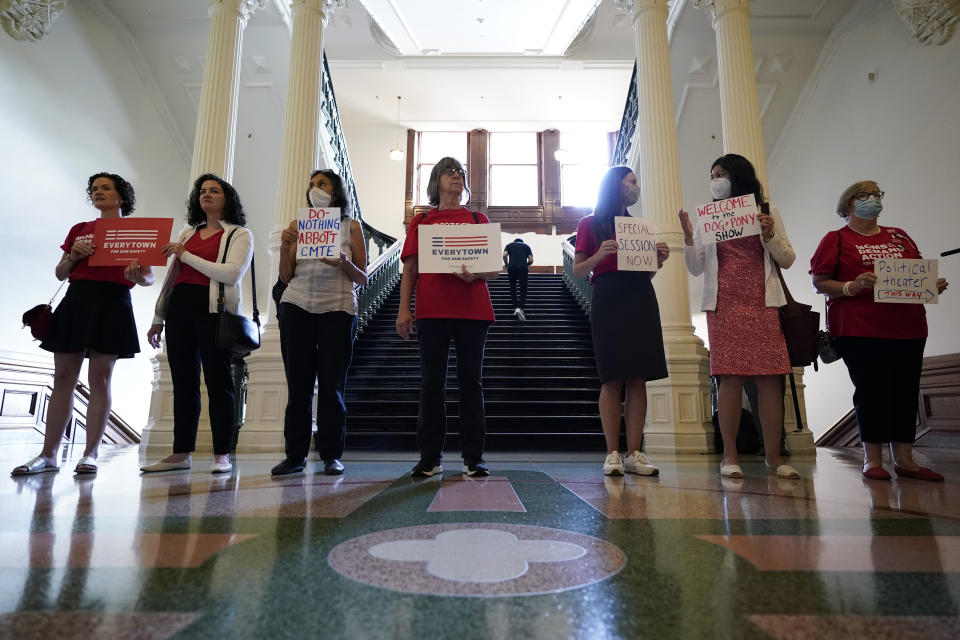 Women with Moms Demand Action gather outside the Texas Senate Chamber as the second day of a hearing begins, Wednesday, June 22, 2022, in Austin, Texas. The hearing is in response to the recent school shooting in Uvalde, Texas, where two teachers and 19 students were killed. (AP Photo/Eric Gay)